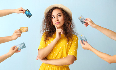 Woman surrounded by credit cards