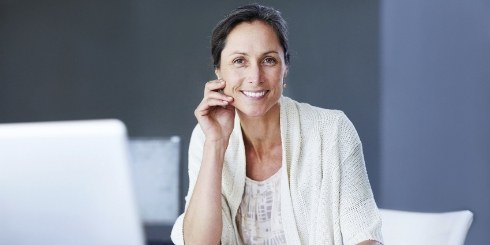 Woman sharing healthy smile after dental checkup