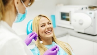 Woman laughing during dental office visit
