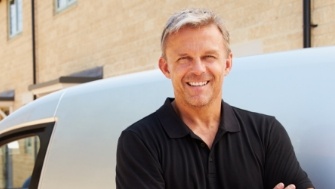 Man smiling and enjoying benefits of dental implants