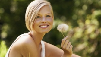 Woman enjoying the health benefits of dental implants