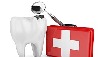Tooth next to red first aid kit on white background