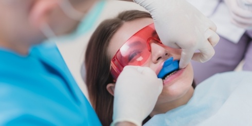 Dental patient receiving fluoride treatment