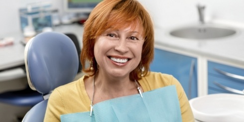 Woman smiling after oral cancer screening