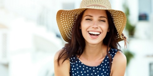 Woman sharing flawless smile after makeover