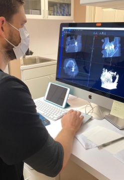 Dentist looking at digital dental impressions