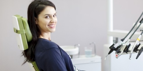 Woman in dental chair smiling