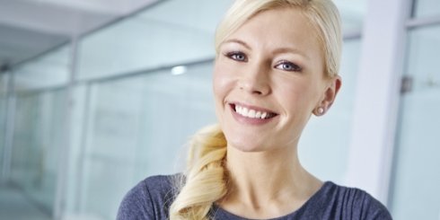 Woman with tooth colored fillings smiling