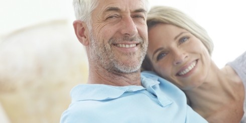 Man and woman with tooth colored fillings smiling