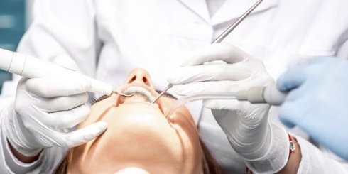 Dentist placing tooth colored fillings
