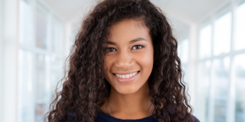 Smiling woman enjoying the benefits of veneers