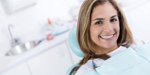 Woman smiling during gum disease screening