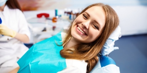 Woman sharing bright smile after teeth whitening